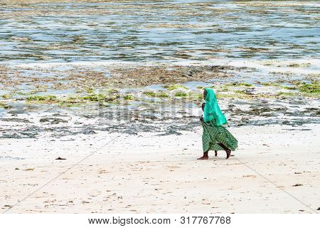Stown Town, Tanzania - 11 January 2015: Local People Walk On Coast In Zanzibar