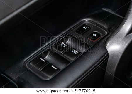 Novosibirsk, Russia - July 31, 2019:  Honda Cr-v, Close-up Of The Side Door Buttons: Window Adjustme