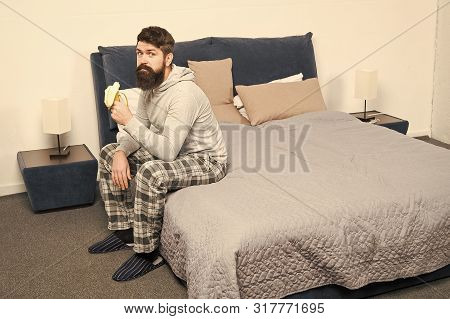 Calorie Snack. Man Bearded Hipster Sleepy Face Pajamas Waking Up Bedroom Interior. Healthy Lifestyle