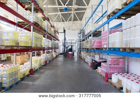 Belarus, The City Of Mensk, April 12, 2019. Chemical Production.worker On A Loader In A Warehouse