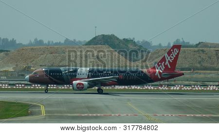 Airplane Taxiing On Runway Of Changi Airport