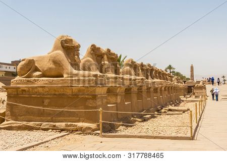 Statues In The Alley Of The Ram-headed Sphinxes In Front Of Temple Of Karnak In Luxor, Egypt - April