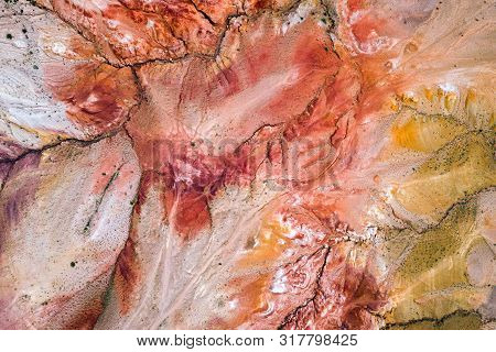 A Stunning Panorama Of A Mountain Chain Of Peaks, A Canyon With Red Clay, Top View. Mars Fields In A