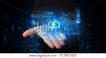 Elegant hand holding battery with full of energy