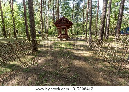 Wooden Camping Arbors  With All Conviniences In A Pine Forest