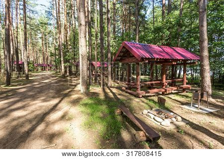 Wooden Camping Arbors  With All Conviniences In A Pine Forest