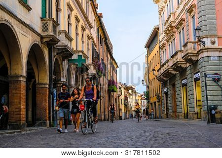 Padova, Italy - July,  , 2019: byciclists on a strett of  Padova , Italy