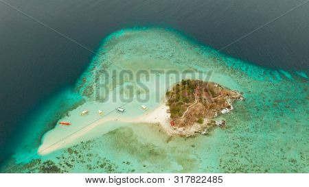 Aerial Seascape Tropical Island And Sand Beach, Turquoise Water And Coral Reef. Malacory Island, Phi