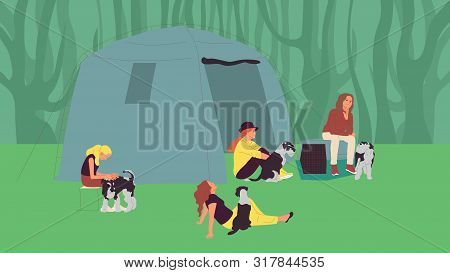 Group Of Girls Sitting Near Tents With Terrier Dogs. Open Air Dog Show Attendants. Camping With Pets