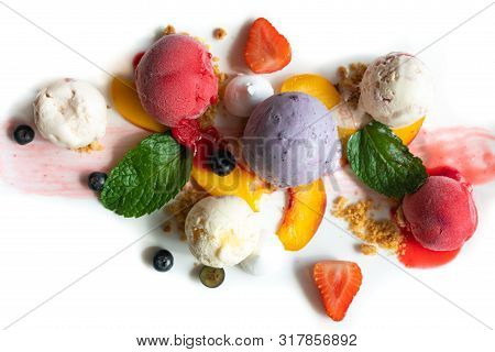 Colorful Fruity Plate Of Ice Cream Scoops With Creamy Blueberry Ice Cream Strawberry And Peach Sorbe