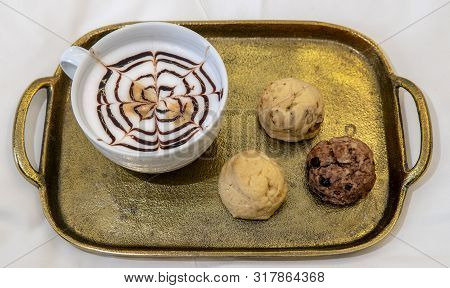 Cappuccino With Baked Goods On Tray