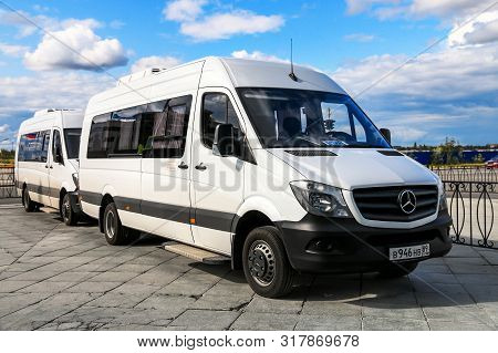 Novyy Urengoy, Russia - August 4, 2019: White Buses Mercedes-benz W906 Sprinter In The City Street.