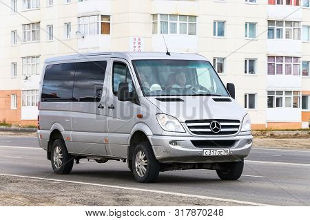 Novyy Urengoy, Russia - August 4, 2019: Grey 4x4 Bus Mercedes-benz W906 Sprinter In The City Street.