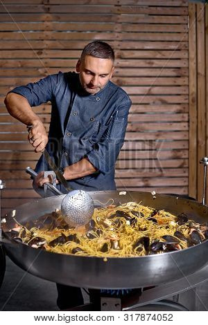 Preparetion Dish Of Spaghetti With Clams In A Restaurant Kitchen