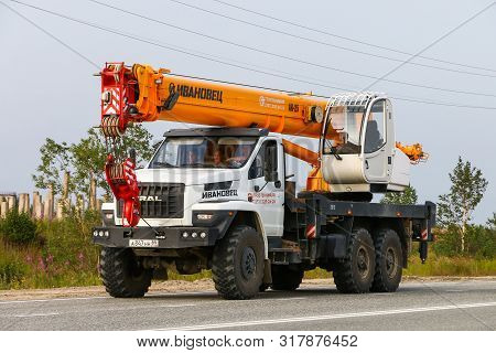 Novyy Urengoy, Russia - July 30, 2019: Modern Construction Crane Ural 4320 Next At The Interurban Ro