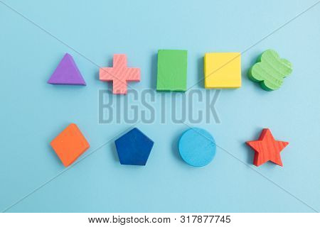 Top View Colorful Wooden Building Blocks With Different Shapes For Developing And Entertainment Of C
