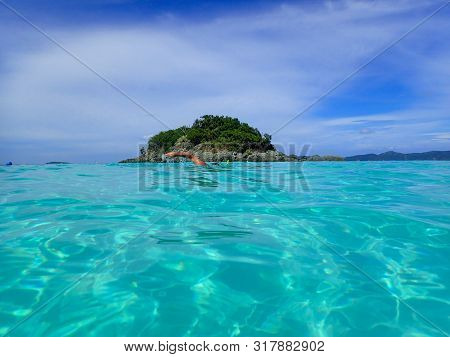 Person Swimming And Snorkeling (free Diving) On A Caribbean Island In Clear Turquoise Water.