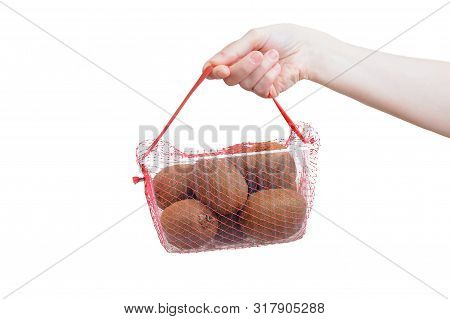 Kiwi In A Plastic Tray In A Grid In The Hands Of A Caucasian Girl. Packaging For Sale. White Isolate