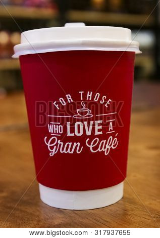 Paper Cup Hot Latte Coffee Of The Juan Valdez Brand, Traditional Colombian Coffee