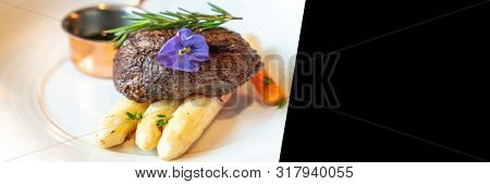 Grilled Salmon Fillet with grilled white asparagus serve with tomato and spinachd esigned for using as web banner