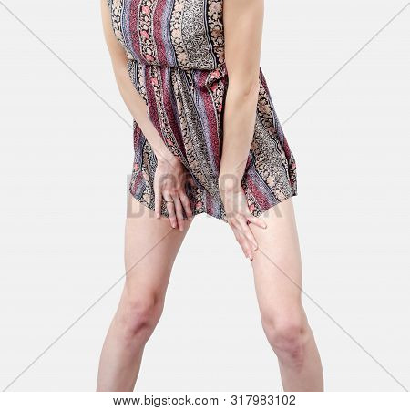 Young Woman In A Dress, Body, Legs, Stands In A Sexy Pose, Spreading Legs Isolated On White Backgrou