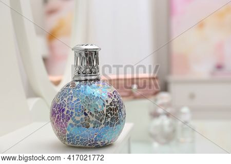 Stylish Catalytic Lamp On White Table Indoors, Space For Text. Interior Element