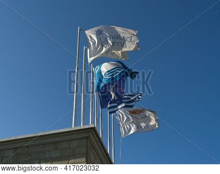Limassol, Cyprus, April 11th, 2021: Flags With Marina Logo, Blue Flag, European Union Flag, National