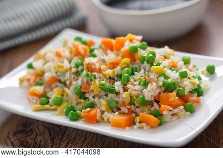 Oriental Cantonese Rice. Basmati Rice With Green Peas, Eggs And Carrots.