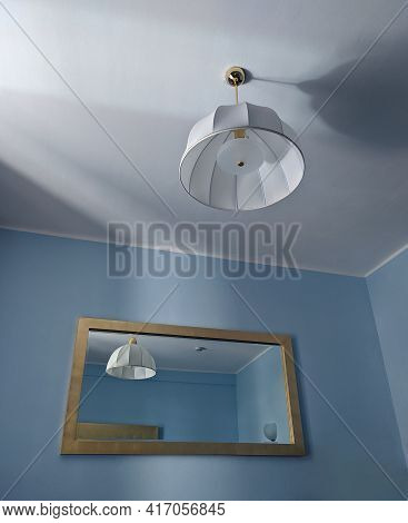 Hotel Room Inernal View With Mirror On A Wall
