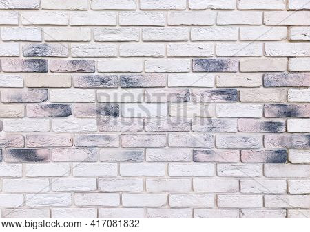 Wall Is Made Of White Ceramic Decorative Interior Bricks With Scorch Marks