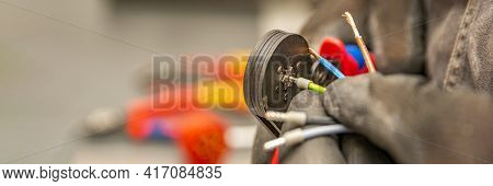 Wire Crimping Tool. Close-up Crimper. A Man Holds A Wire Crimper. Equipment For The Electrician. Cop
