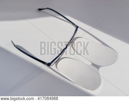 Top View Of Eyeglasses On White Background. Comfortable Life With Poor Eyesight. Ophthalmology. Cont