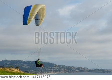 Man Doing Sport, Para-glider In The Clouded Sky. Paragliding Is An Extreme Sport And Recreation. Tor