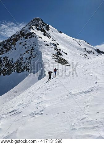 Ski Tour On The Fanellhorn Above Vals Grisons. Ascent Over The West Flank. Beautiful Snowy Mountains