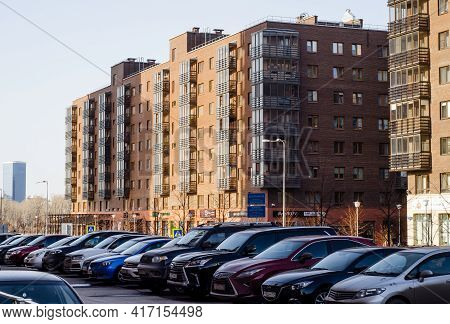 Modern Multi-storey Residential Buildings Built Of Brick, With Car Parking In  Courtyard. Russia. Kr
