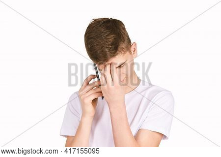 Children Portrait In White T-shirt. Studio Isolated Concept. Boy With Black Smartphone. Bored Emotio