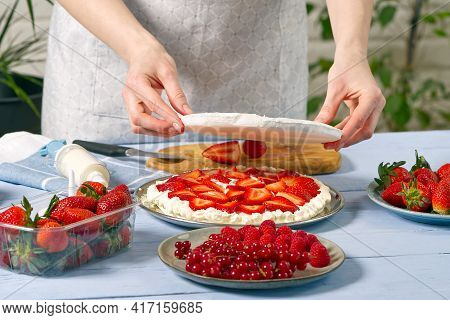 Woman Baker Add A New Layer Of Meringue Base In Strawberry Cake. Homemade Strawberries Cake Made Fro