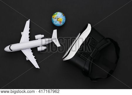Virtual Travel. Virtual Reality Headset With Plane, Globe On Black Background. Top View