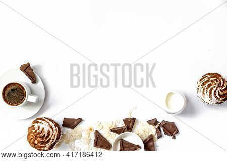Dark Chocolate And Cocoa Chocolate Cupcakes With A Cup Of Hot Black Coffee. Space For Text