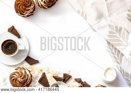 Dark Chocolate And Cocoa Chocolate Cupcakes With A Cup Of Hot Black Coffee. Space For Text