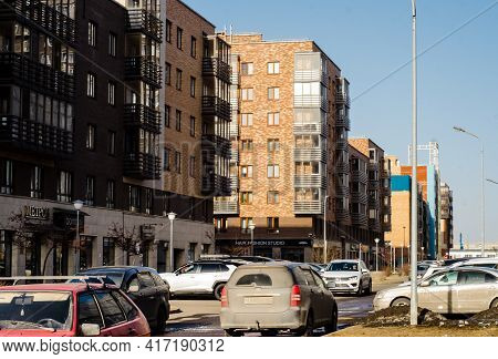 Modern Multi-storey Residential Buildings Built Of Brick, With Car Parking In  Courtyard. Russia. Kr