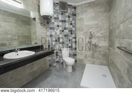 Interior Design Of A Luxury Show Home Bathroom With Disabled Access Shower Wet Room And Sink