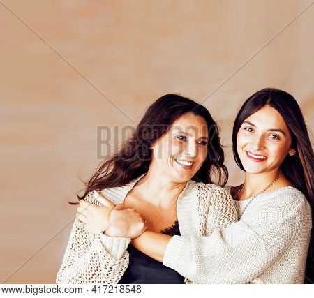 Cute Pretty Teen Daughter With Mature Mother Hugging, Fashion Style Brunette Makeup Together, Warm C