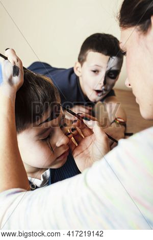 Little Cute Child Making Facepaint On Birthday Party, Zombie Apocalypse Facepainting, Halloween Prep