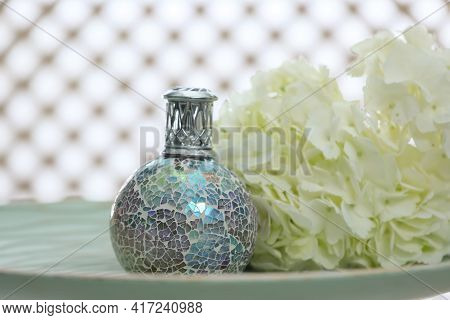 Burning Catalytic Purifying And Flowers On Table, Space For Text