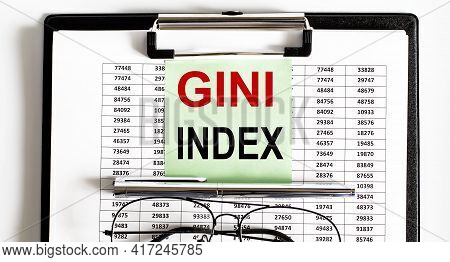 Closeup Of Deadline Time Of Gini Index And Glasses And Pen