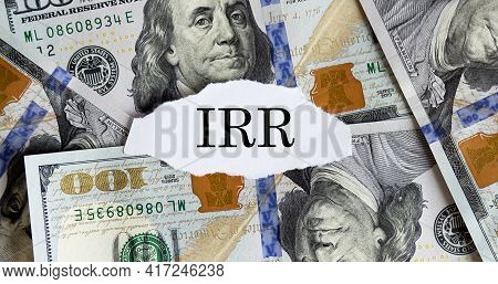 Usa Dollar With Finance Text Internal Rate Of Return Irr On Torn Piece Paper. Business