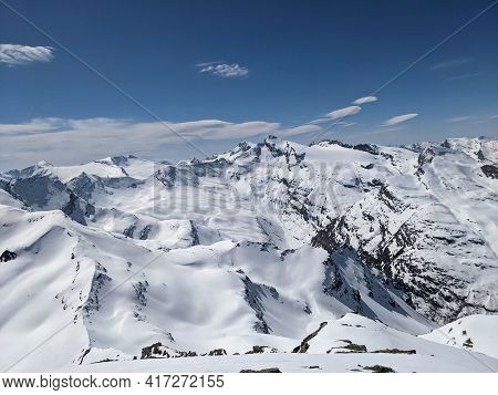 Large Winter Panorama On The Fanellhorn In Canton Of Grisons. Lots Of Snowy Mountain Peaks. Ski Tour
