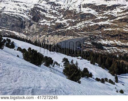 Reservoir, Large Dam In The Valser Valley In The Zervreila.zervreila Lake Ski Run From The Fanellhor