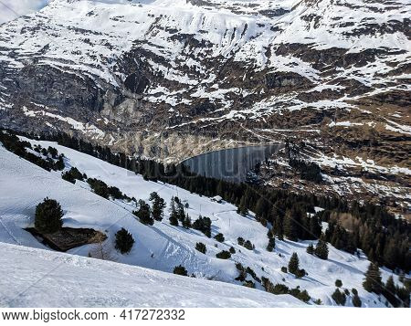 Reservoir, Large Dam In The Valser Valley In The Zervreila.zervreila Lake Ski Run From The Fanellhor